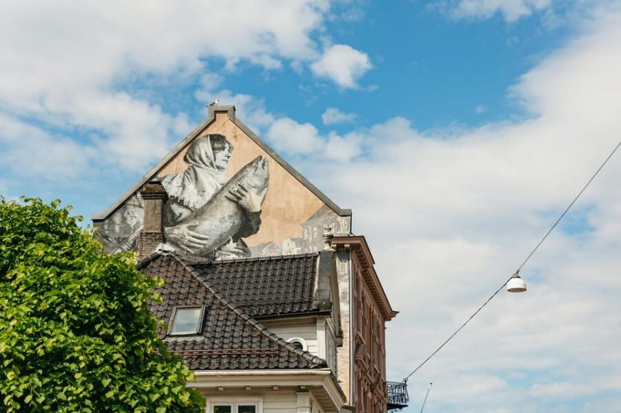 Bergen: Past & Present Small Group Guided Walking Tour - Bergenhus Fortress: From King Håkon to a Rainy City Myth