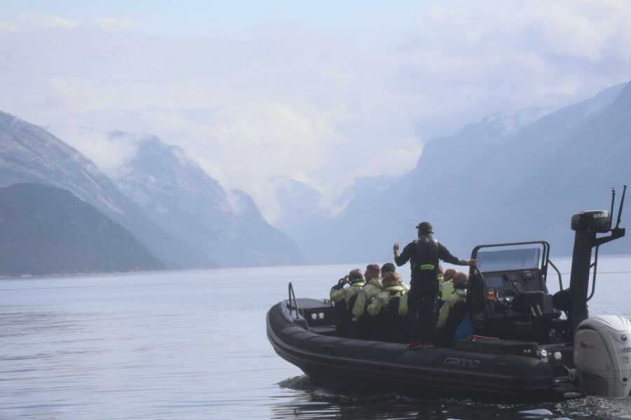 From Stavanger: RIB Tour to Lysefjord - Lysefjord highlights: Preikestolen below, Vagabond Cave, and Whisky Falls