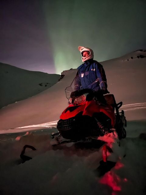From Tromso: Arctic Wilderness Snowmobile Evening Tour - Basecamp dinner and winter gear: warm start, no scavenger hunt