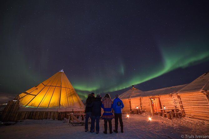 Night Reindeer Sledding with Camp Dinner and Chance of Northern Lights - Inside the candlelit Gamme: dinner, joiking, and Sámi stories