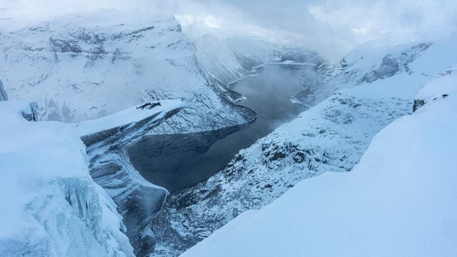Odda: Trolltunga Winter Hike on Snowshoes - Snowracer fun: sliding down from P3 to P2