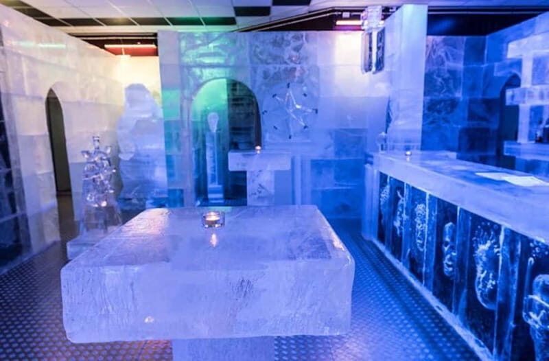 Tromsø: Magic Ice Bar Entrance and Welcome Drink - Ice gallery walk-through: Viking myths and Arctic explorer carvings