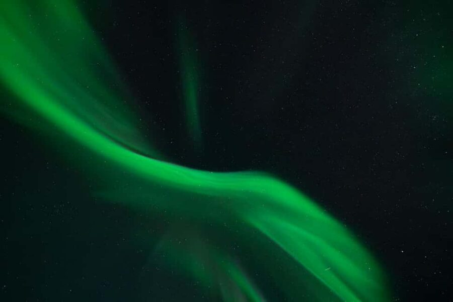 Tromsø: Northern Lights in a Minivan with Free Photos and a Hot Meal - Entering Tromsø’s aurora hunt from Scandic Ishavshotel
